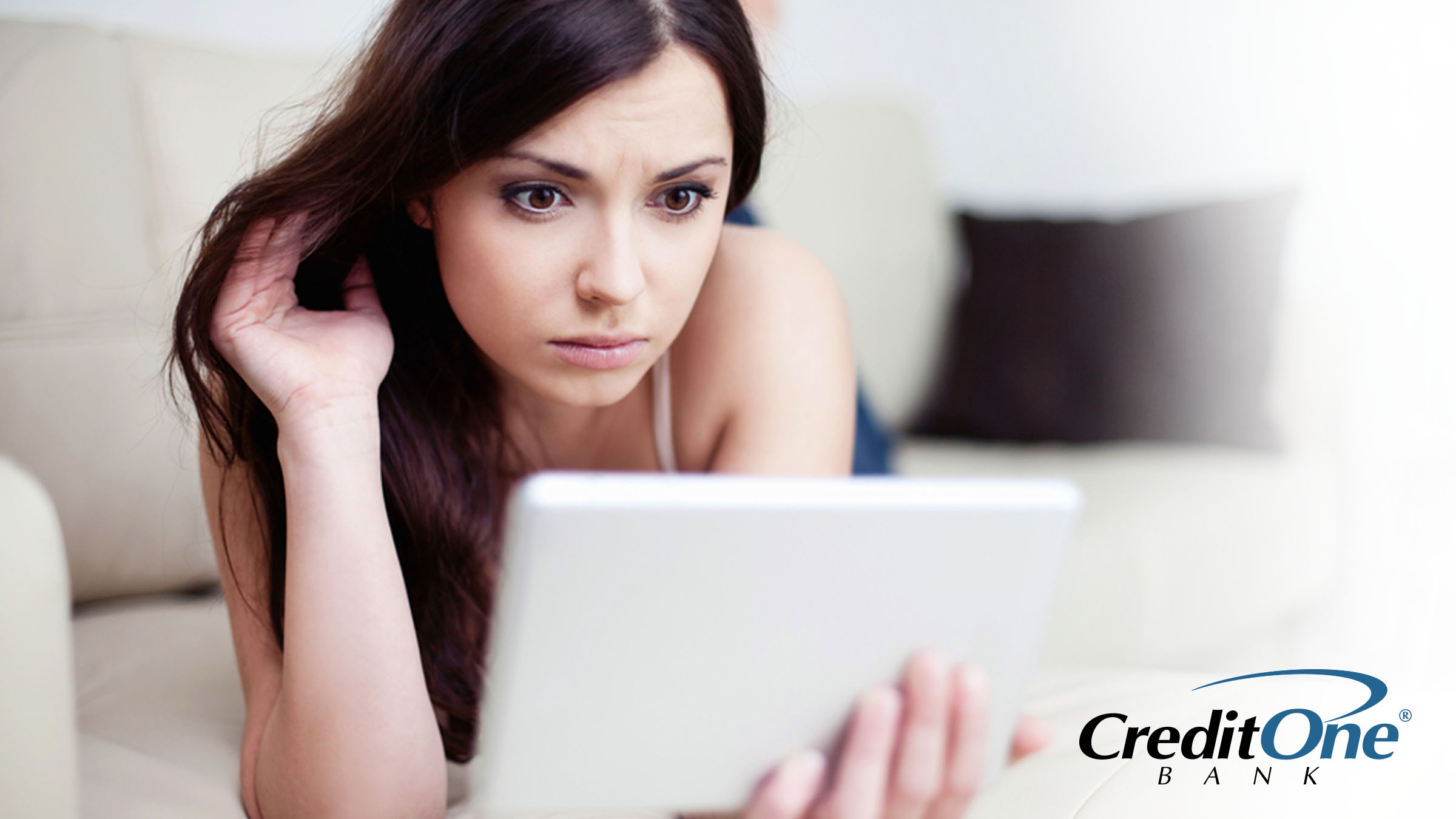 Woman reviewing her credit score and credit reports on tablet device